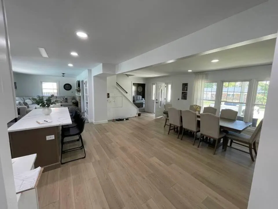 After: looking from the kitchen through the open plan to the stair and front door