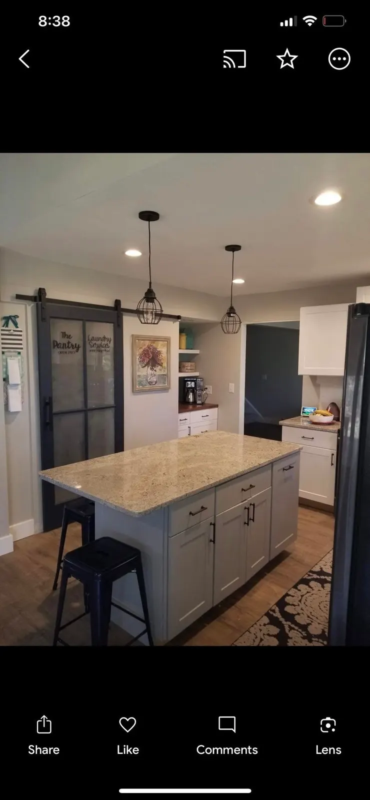 After: the sliding barn door to the pantry beside the island
